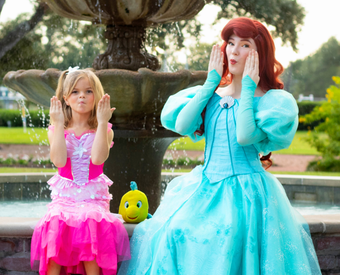 The Little Mermaid and her human friend making funny faces at the camera